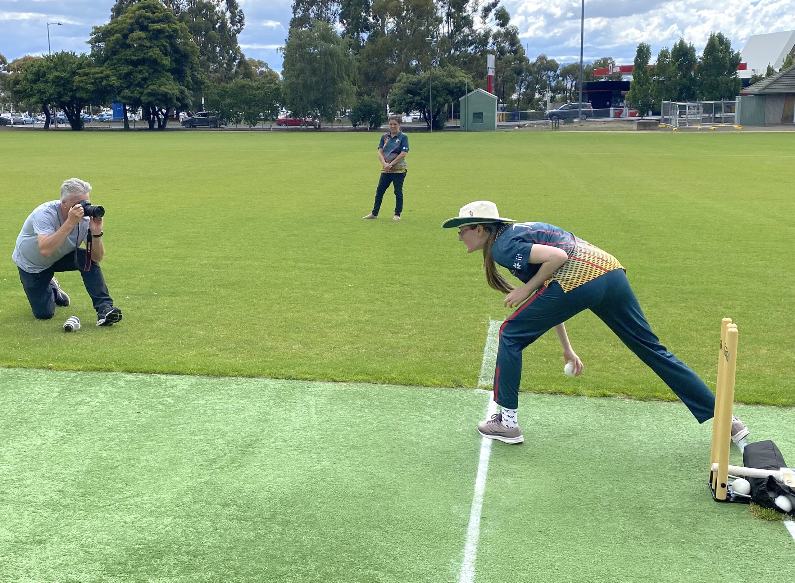 Steve Waugh taking a photo of Nicole bowling