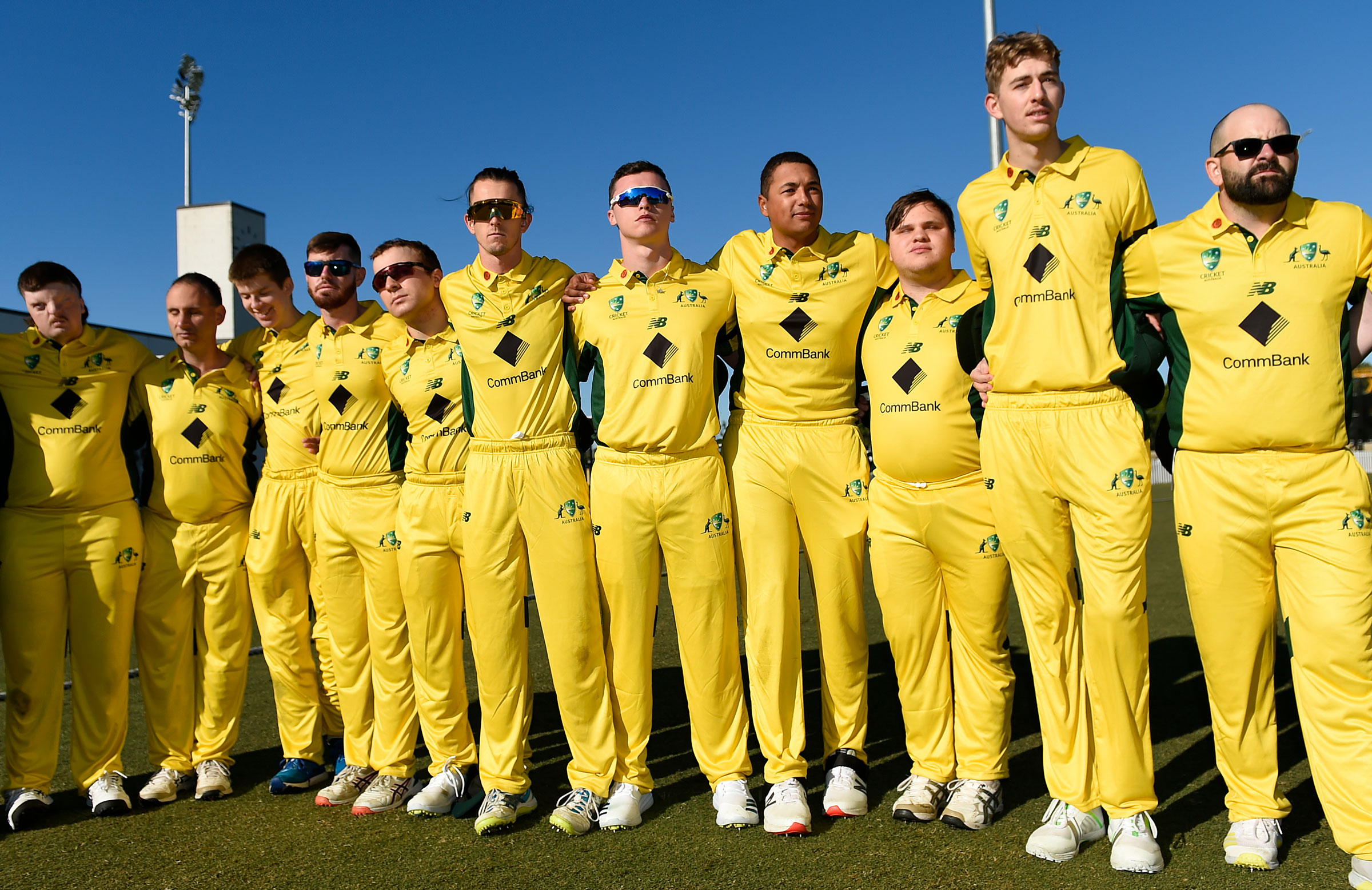 The Australian Blind cricket team lined up for a photo at an international game