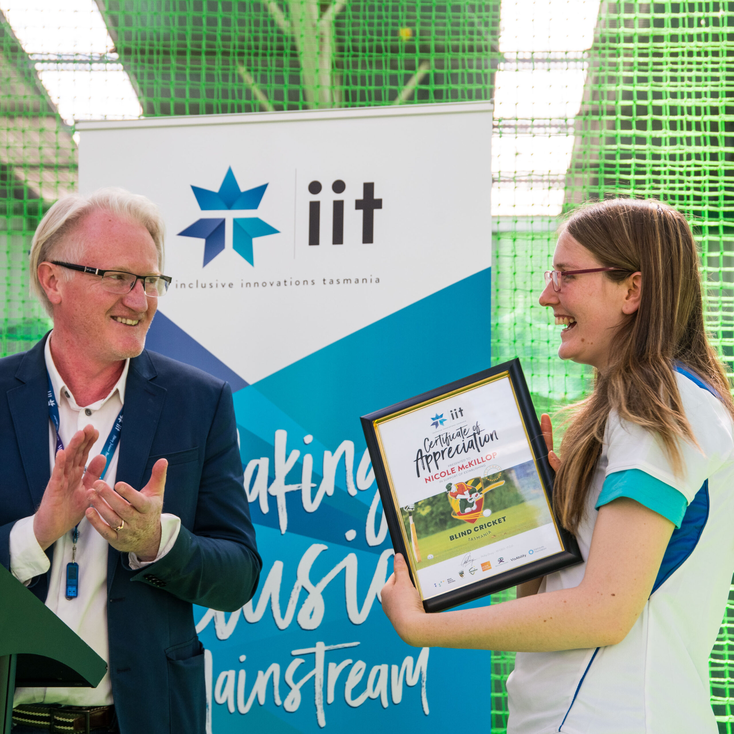 Nicole McKillop receiving a certificate of appreciation form IIT CEO Sunny Drury for her work as the BCT Youth Ambassador. Nicole is also a state team player.