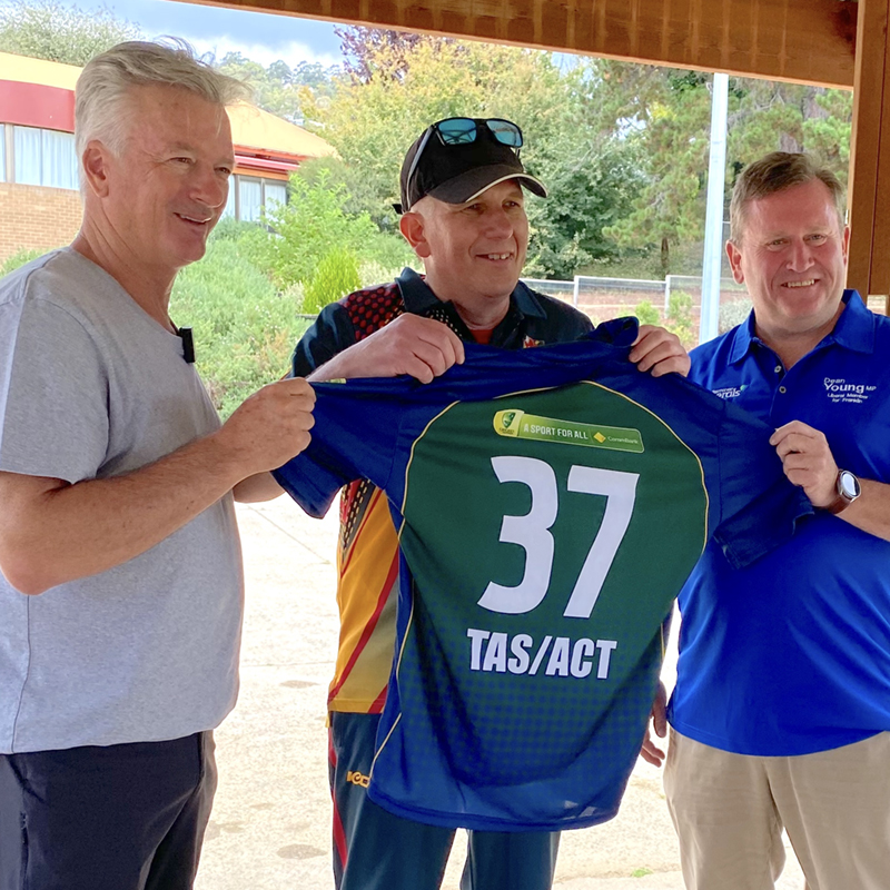 David Hughes being presented with is TAS/ACT playing top by Steve Waugh and Dean Young MP