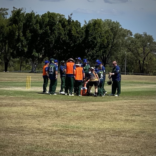 The CATS team in a drinks break out in the middle of the ground