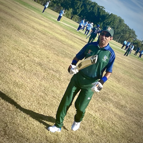 Neville D'Silva walking off the field after batting agains NSW