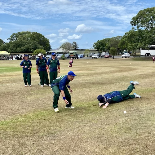 Two ACT CATS players doing pre-game fielding practice