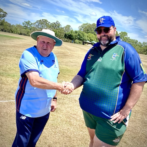 NWS team official Graham Coulton shakes hands with the CATS assistant Manager Jason Schmidt before the game