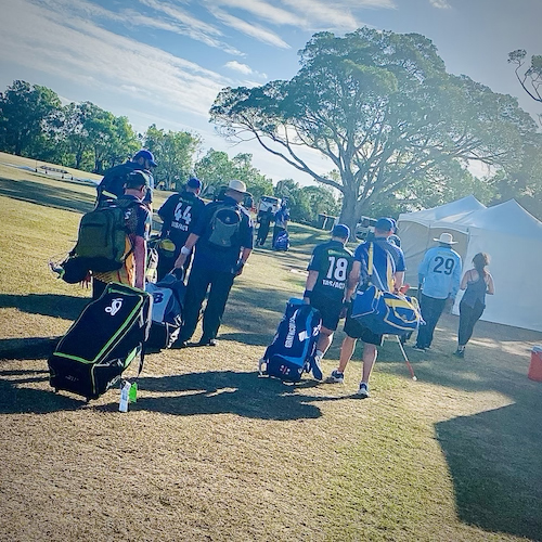 The TAS/ACT CATS walking from the ground to board the team bus at the end of a day's play