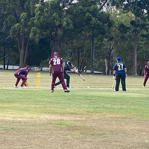 CATS player batting against Queensland and hitting the ball into the outfield