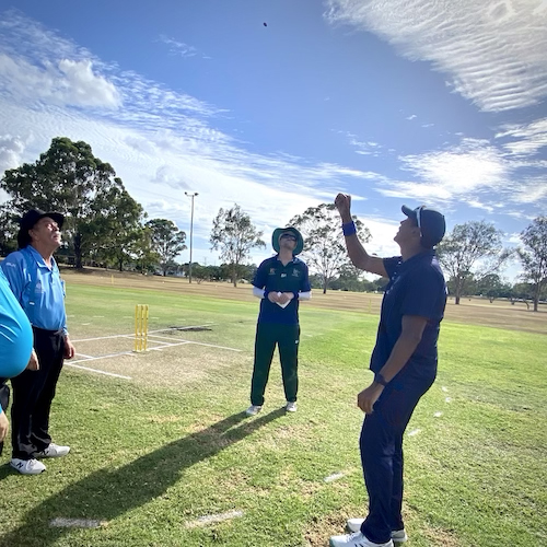 CATS Captain Michael Hamilton watches the coin tossed in the air by the Victorian team Captain