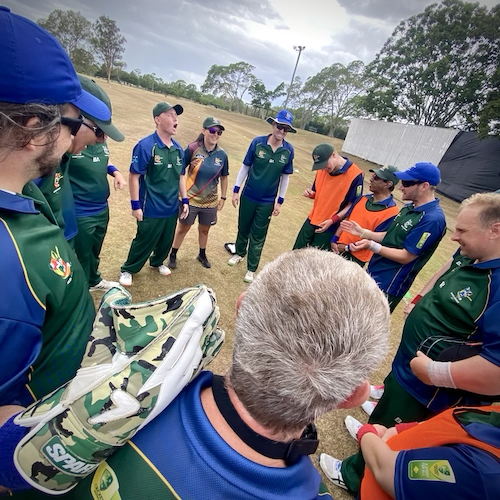 Team in a huddle getting ready to take the field