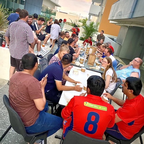 A dinner gathering of South Australia, Western Australia and TAS/ACT Cats players on the outside deck at the hotels