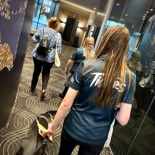 Nicole McKillop and her Guide Dog Harper entering the main foyer at the presentation dinner venue