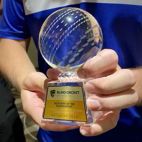 A close up of the glass trophy (of a cricket ball on a stand) for Mathew Kent being B2 player of the tournament