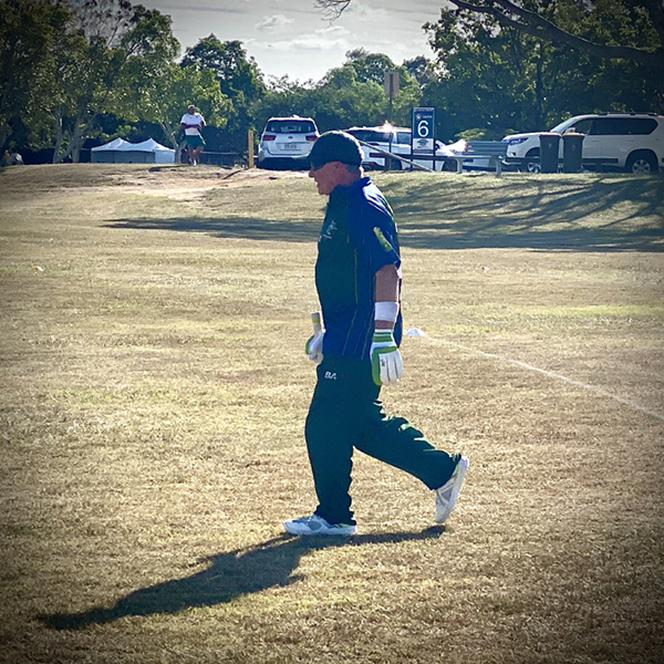 Phil Menzie walking out to bat