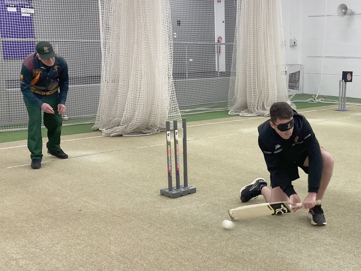 Cricket Tasmania staff member batting at the BCT training session