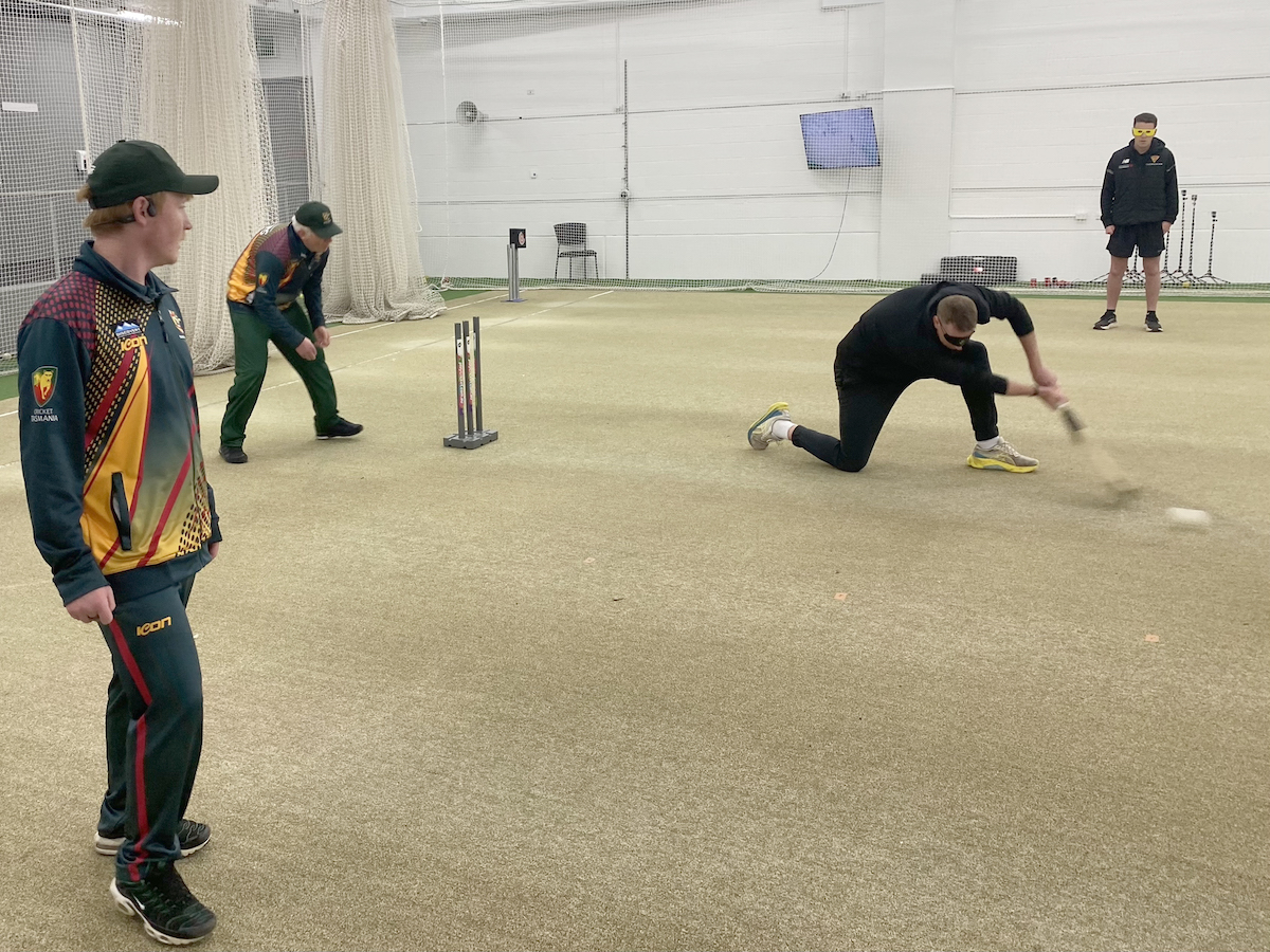 Cricket Tasmania staff member batting at the BCT training session