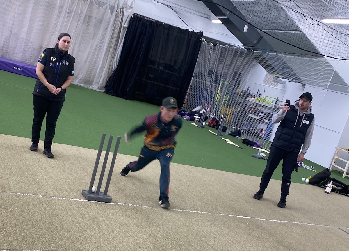 A Tigers player bowls a ball to a Cricket Tasmania staff member at the BCT training session