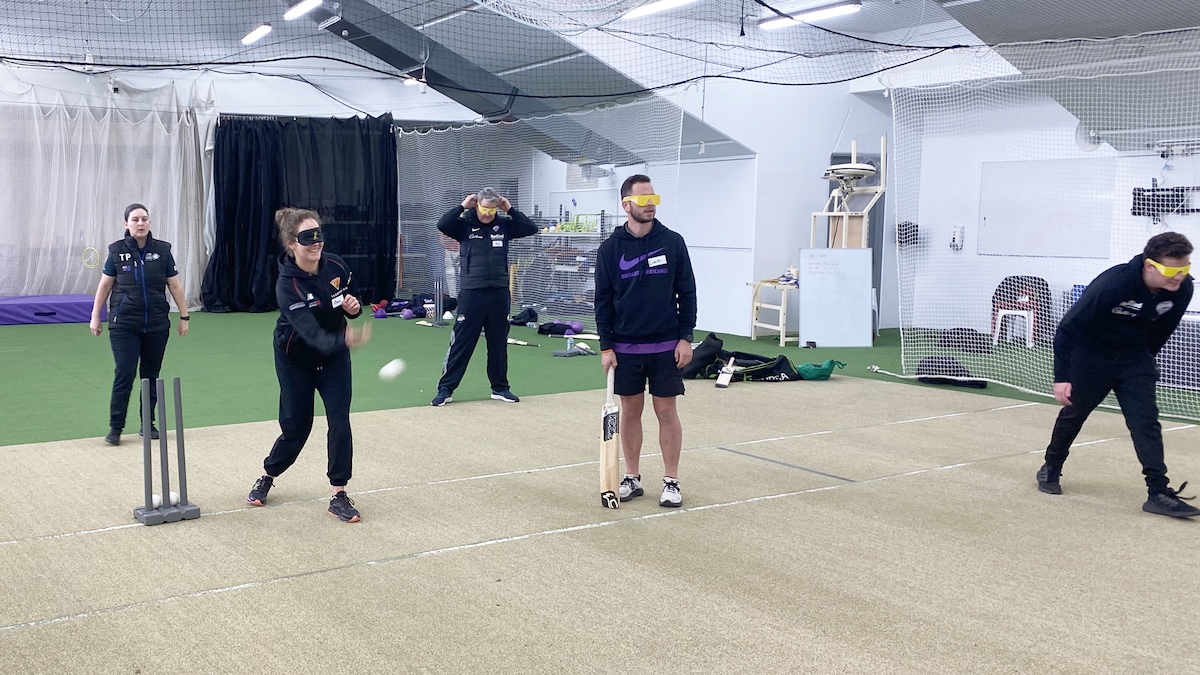 Cricket Tasmania staff member bowling at the BCT training session