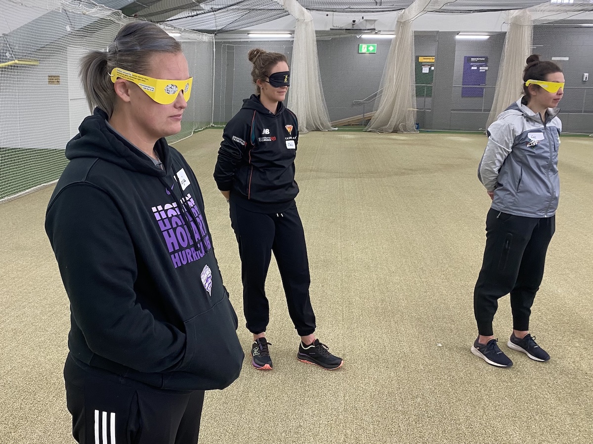 Cricket Tasmania staff wearing the simulation glasses at the BCT training session